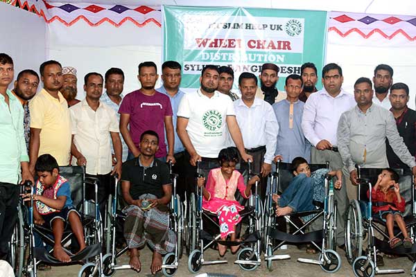 বিশ্বনাথে প্রতিবন্ধীদের মাঝে হুইল চেয়ার বিতরণ