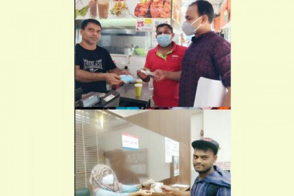সিঙ্গাপুরে প্রবাসী বাংলাদেশিদের মধ্যে মাস্ক বিতরণ
