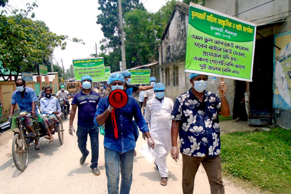 করোনা প্রতিরোধে দিনাজপুরে র‌্যালি ও মাস্ক বিতরণ 
