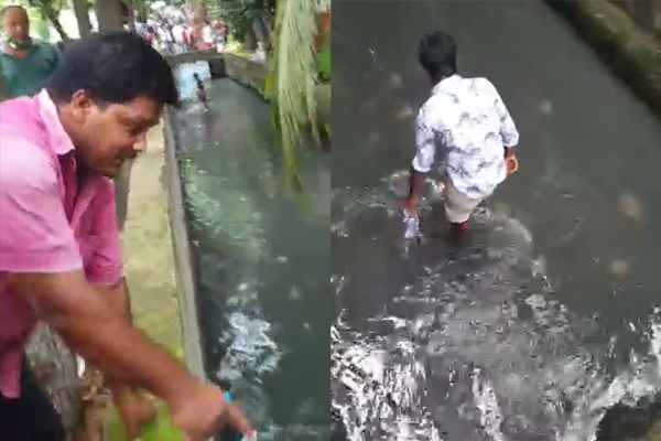 রাজশাহীতে ড্রেনে টাকা কুড়াচ্ছে মানুষ (ভিডিও)