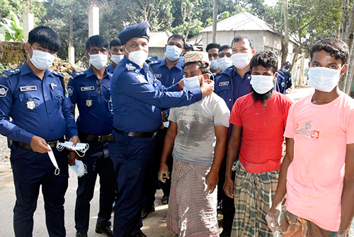 ধুনটে করোনা প্রতিরোধে থানা পুলিশের মাস্ক বিতরণ