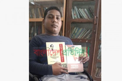 হুইল চেয়ারে ১০কিমি পাড়ি দিয়ে বই পড়েন প্রতিবন্ধী আনোয়ার