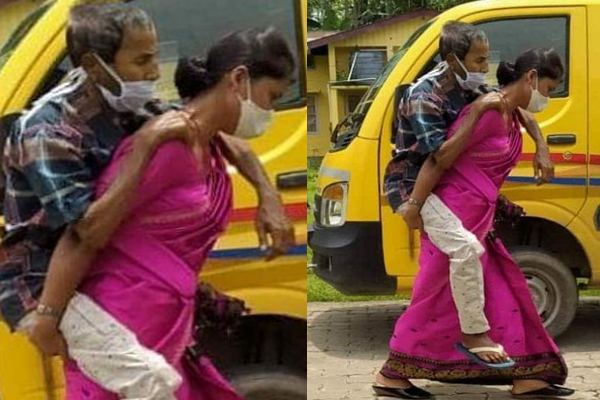 করোনা আক্রান্ত শ্বশুরকে পিঠে করে হাসপাতালে নিলেন পুত্রবধূ