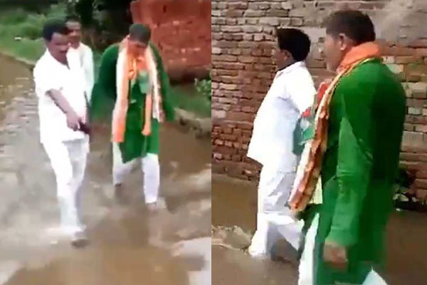 রাস্তার নোংরা পানিতে বিজেপি বিধায়ককে হাঁটালেন বিক্ষুব্ধ গ্রামবাসী!