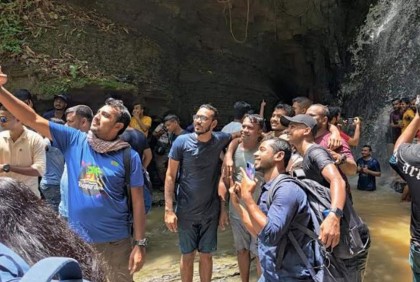 পাহাড়ি ঝর্ণায় পর্যটকের ঢল