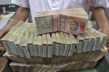 জানালা দিয়ে টাকা ফেলে গোপন করার চেষ্টা, উদ্ধার হলো কোটি কোটি রুপি
