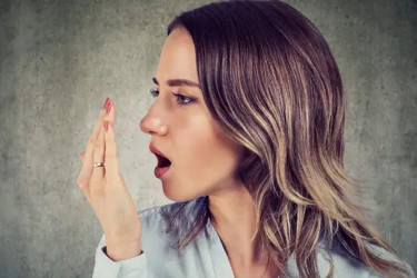 মুখে দুর্গন্ধ, জেনে নিন প্রতিকার