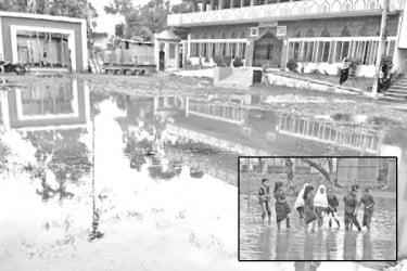 বিদ্যালয় মাঠে পানি বিপাকে শিক্ষার্থীরা