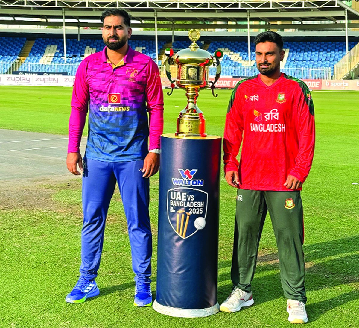 ট্রফি নিয়ে ফটোসেশনে বাংলাদেশ অধিনায়ক লিটন দাস ও আমিরাতের মোহাম্মদ ওয়াসিম